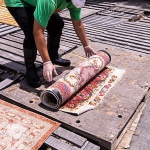 rug cleaners drying rug in the sun